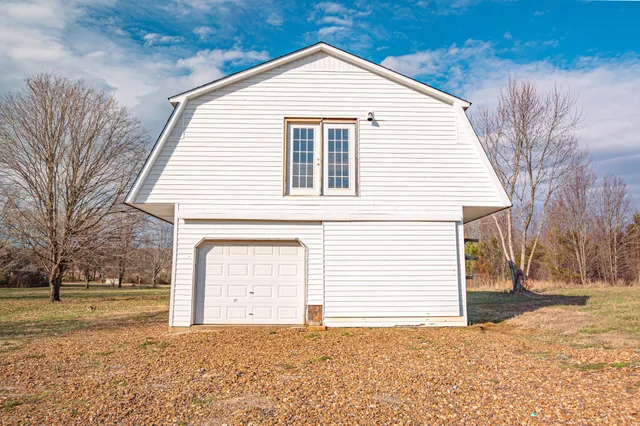 an aerial view of a house with outdoor space