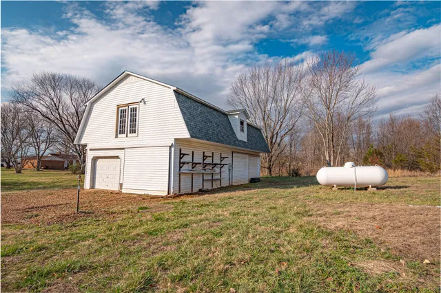 an aerial view of a house with outdoor space