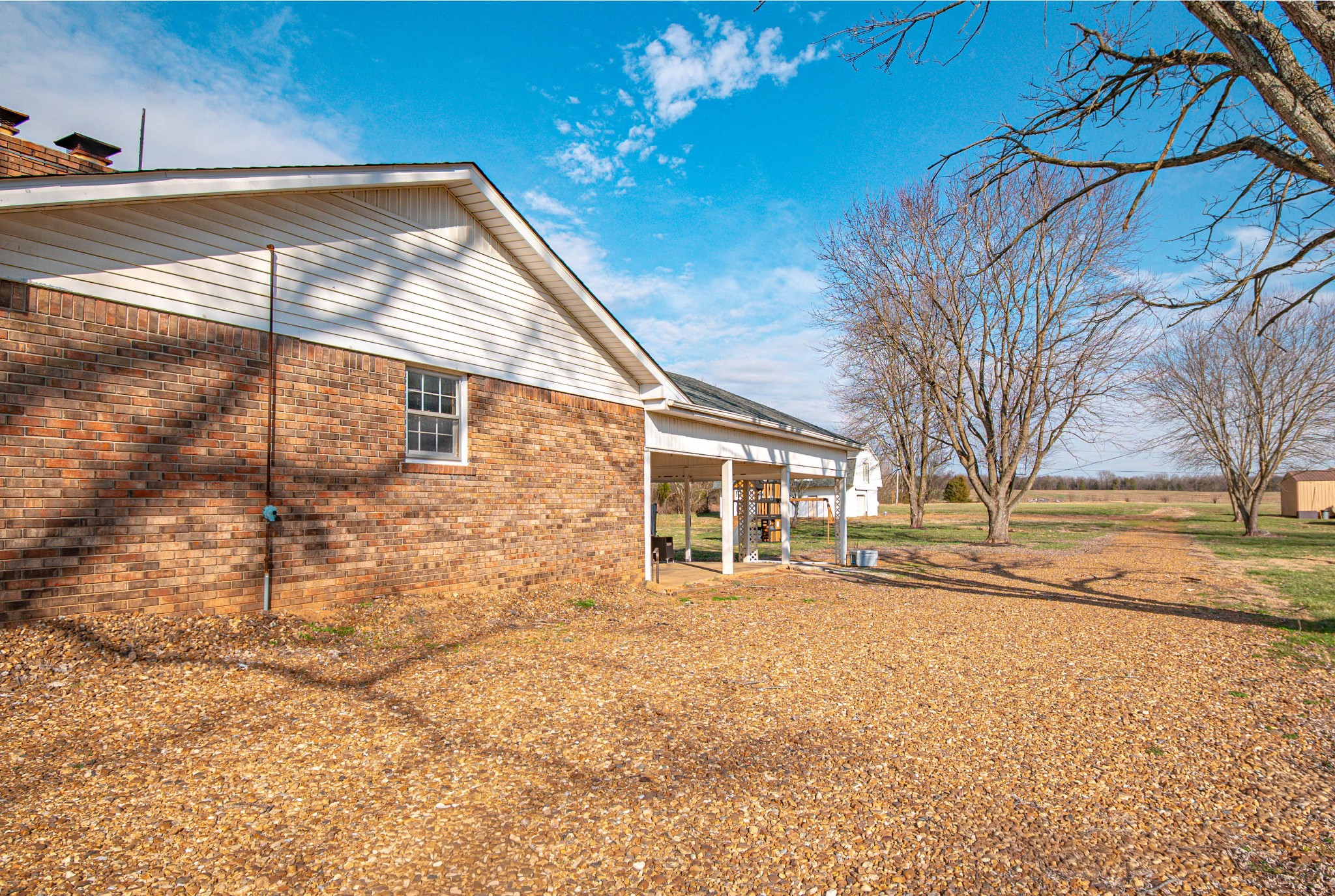 674 Girkin Road Bowling Green, KY 42101 - Photo 6 of 50 a backyard of a house with fire pit and trees