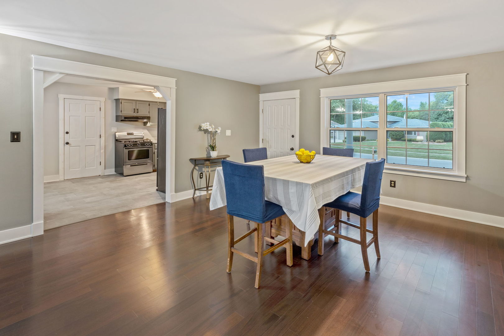 600 Stonegate Road New Lenox, IL 60451 - Photo 3 of 23 a view of a dining room with furniture window and wooden floor