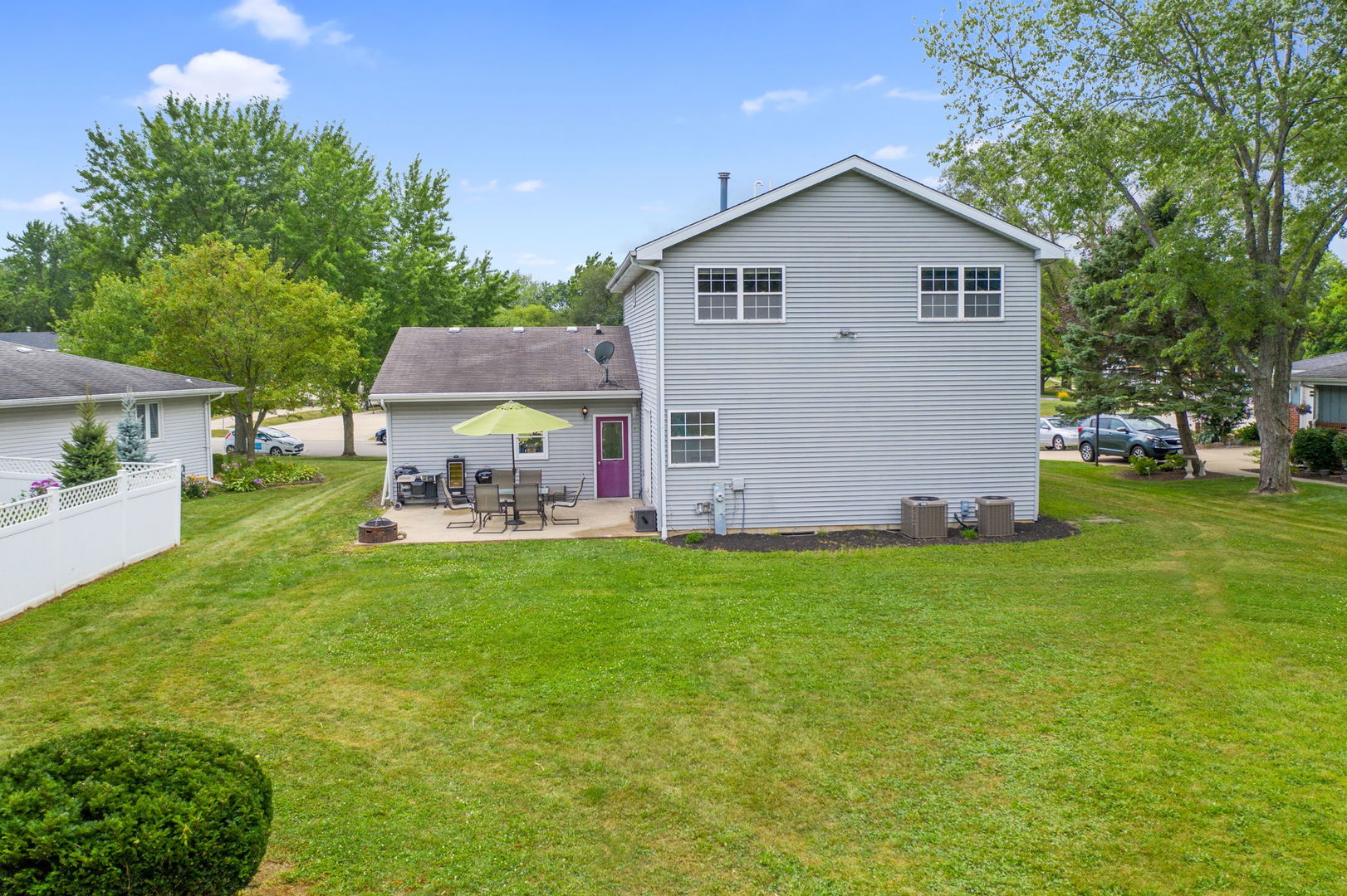 600 Stonegate Road New Lenox, IL 60451 - Photo 21 of 23 a view of a backyard with table and chairs and potted plants