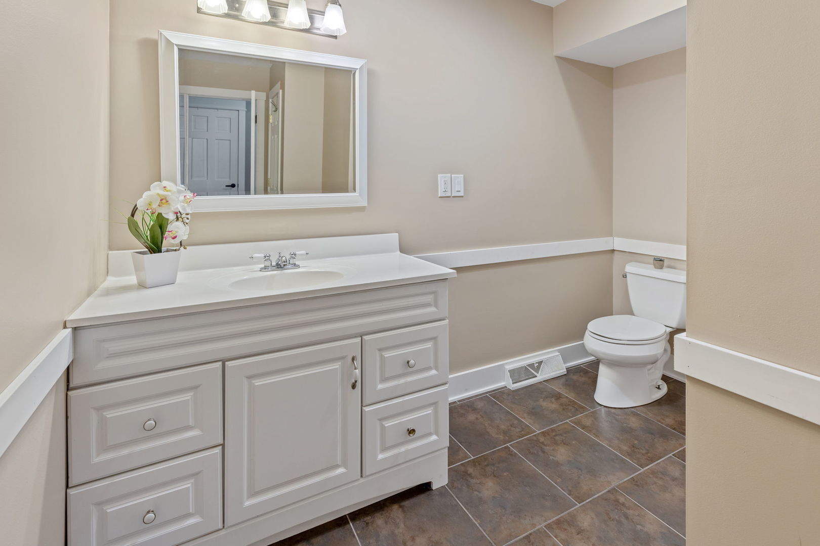 600 Stonegate Road New Lenox, IL 60451 - Photo 7 of 23 a bathroom with a sink a toilet and a mirror