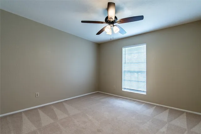 a front view of house with yard and trees