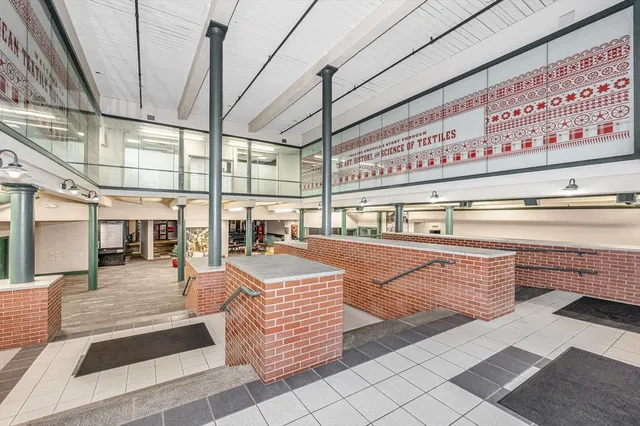 a room with lots of wooden furniture and lots of counter top space