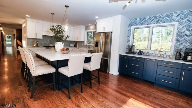 a view of a dining room with furniture and window