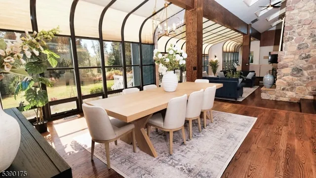 a dining room with furniture and wooden floor