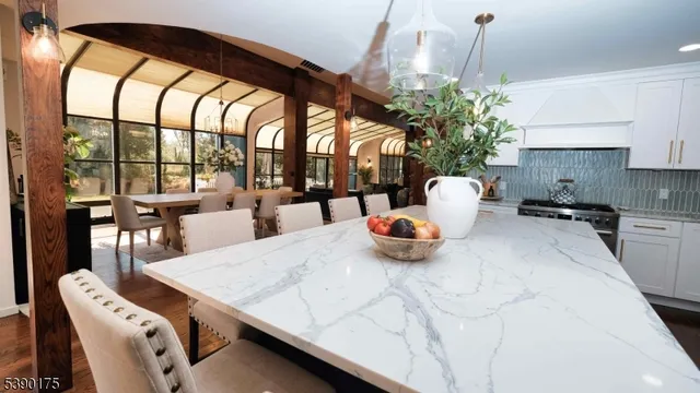 a view of a dining room with furniture and window