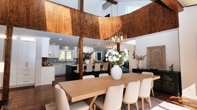 a dining room with furniture and wooden floor