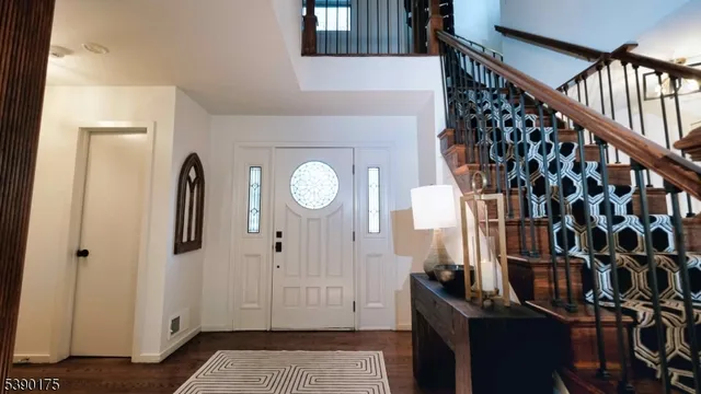 a view of an entryway with wooden floor