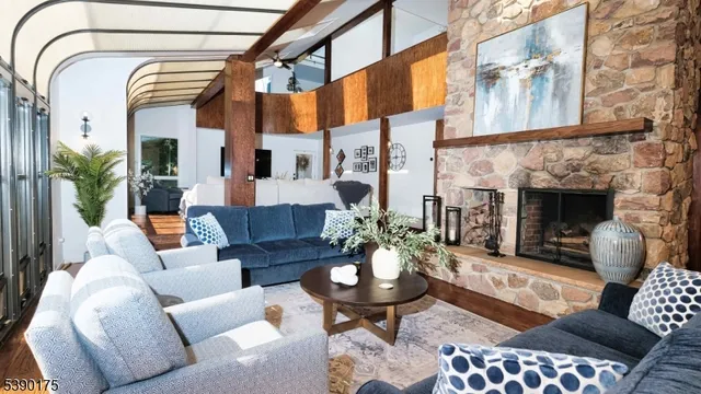 a living room with furniture fireplace and a fireplace