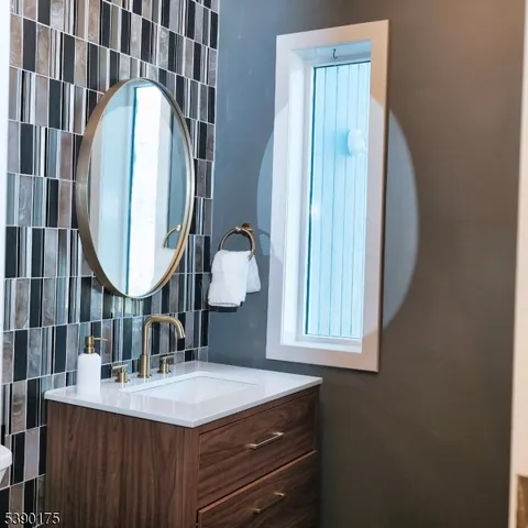 a large kitchen with stainless steel appliances a large counter top