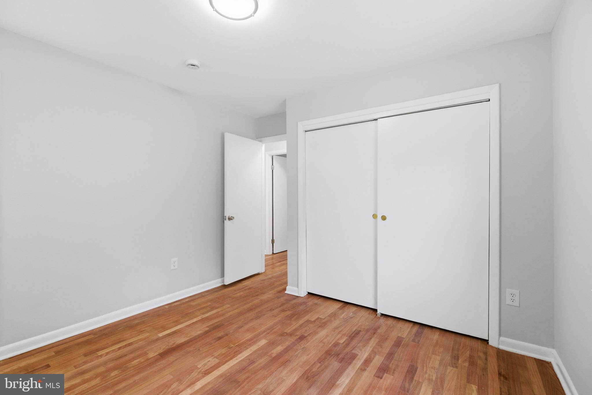 14033 Grayson Road Woodbridge, VA 22191 - Photo 16 of 33 a view of an empty room with wooden floor