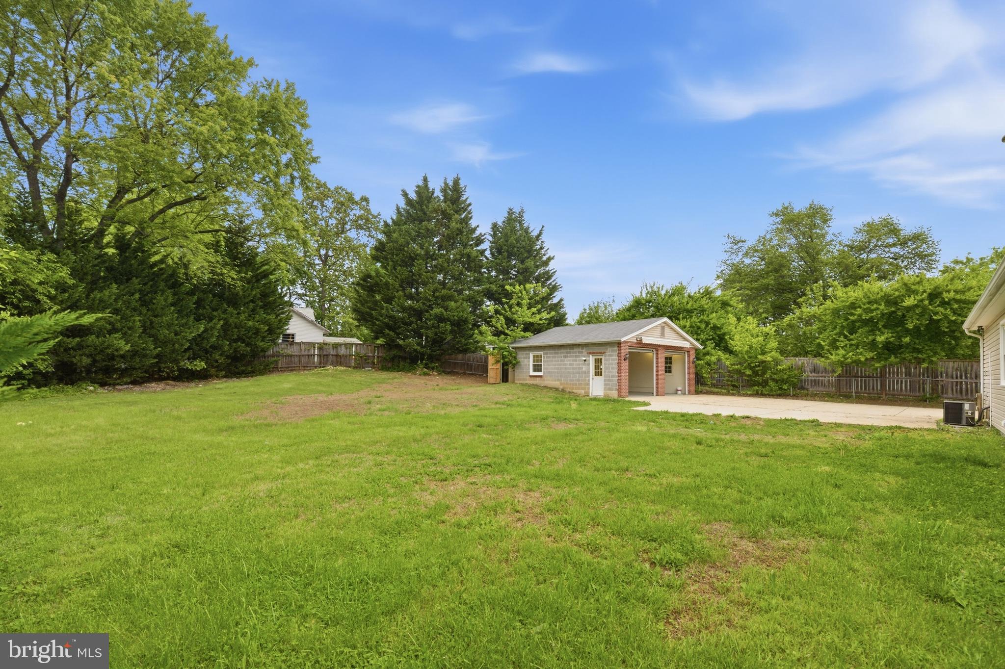 14033 Grayson Road Woodbridge, VA 22191 - Photo 24 of 33 a front view of a house with a yard