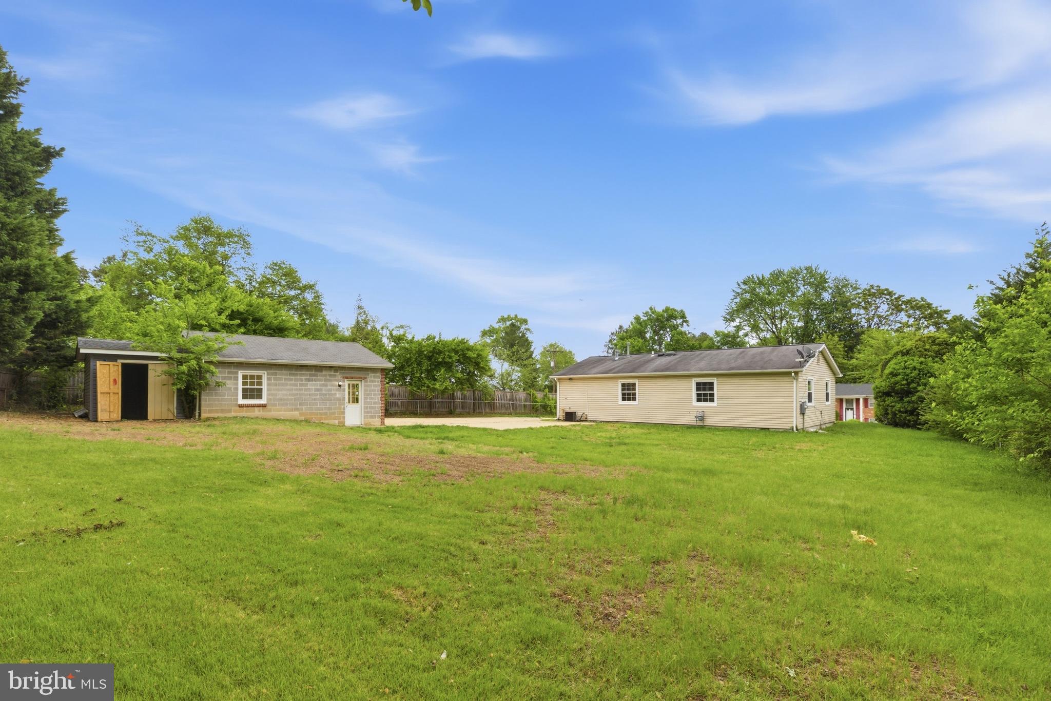 14033 Grayson Road Woodbridge, VA 22191 - Photo 25 of 33 a house with huge green field in front of it