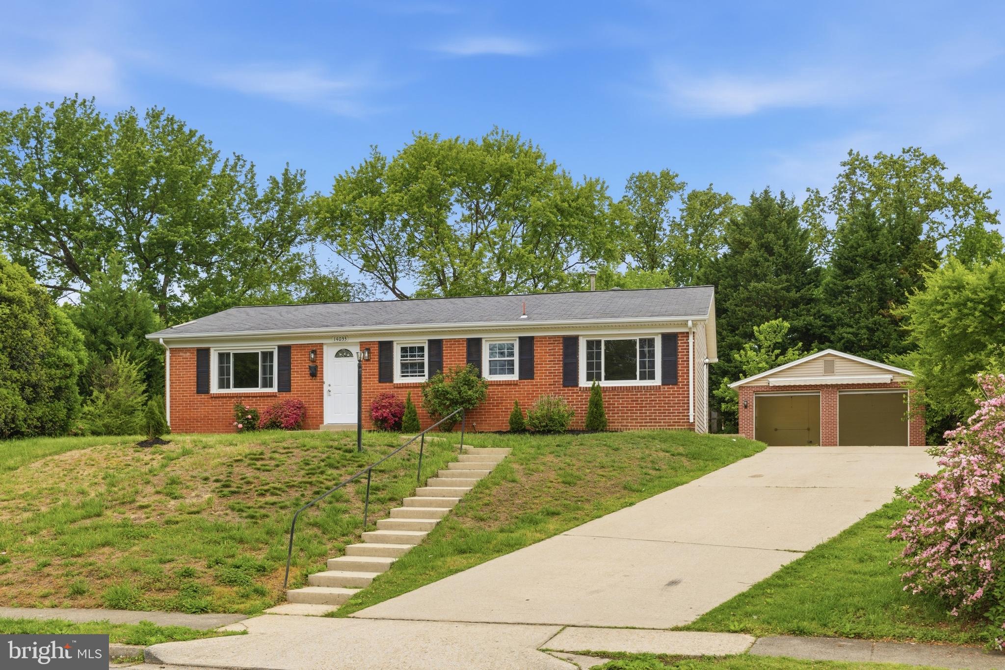 14033 Grayson Road Woodbridge, VA 22191 - Photo 28 of 33 a front view of a house with garden