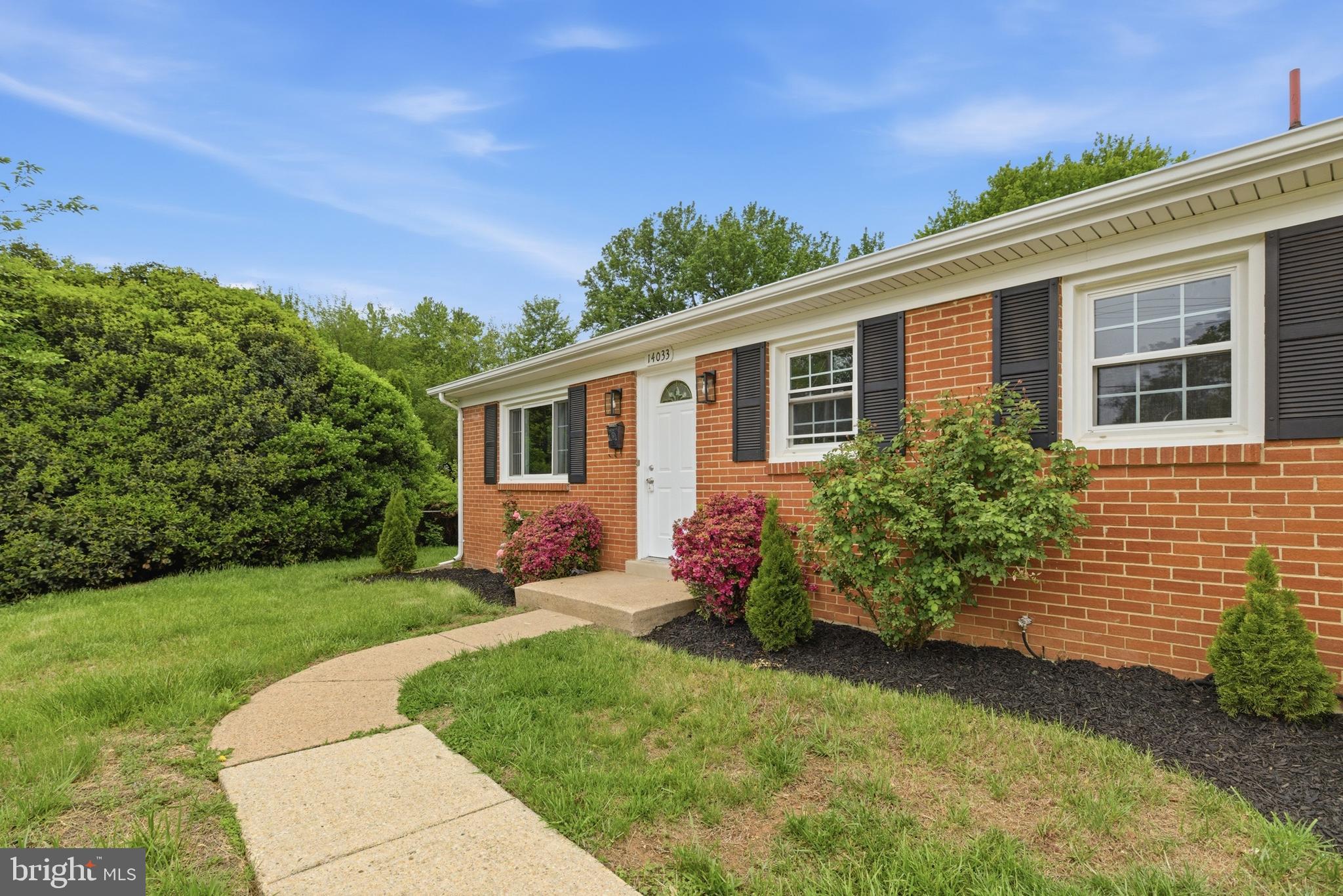 14033 Grayson Road Woodbridge, VA 22191 - Photo 3 of 33 a front view of a house with a yard