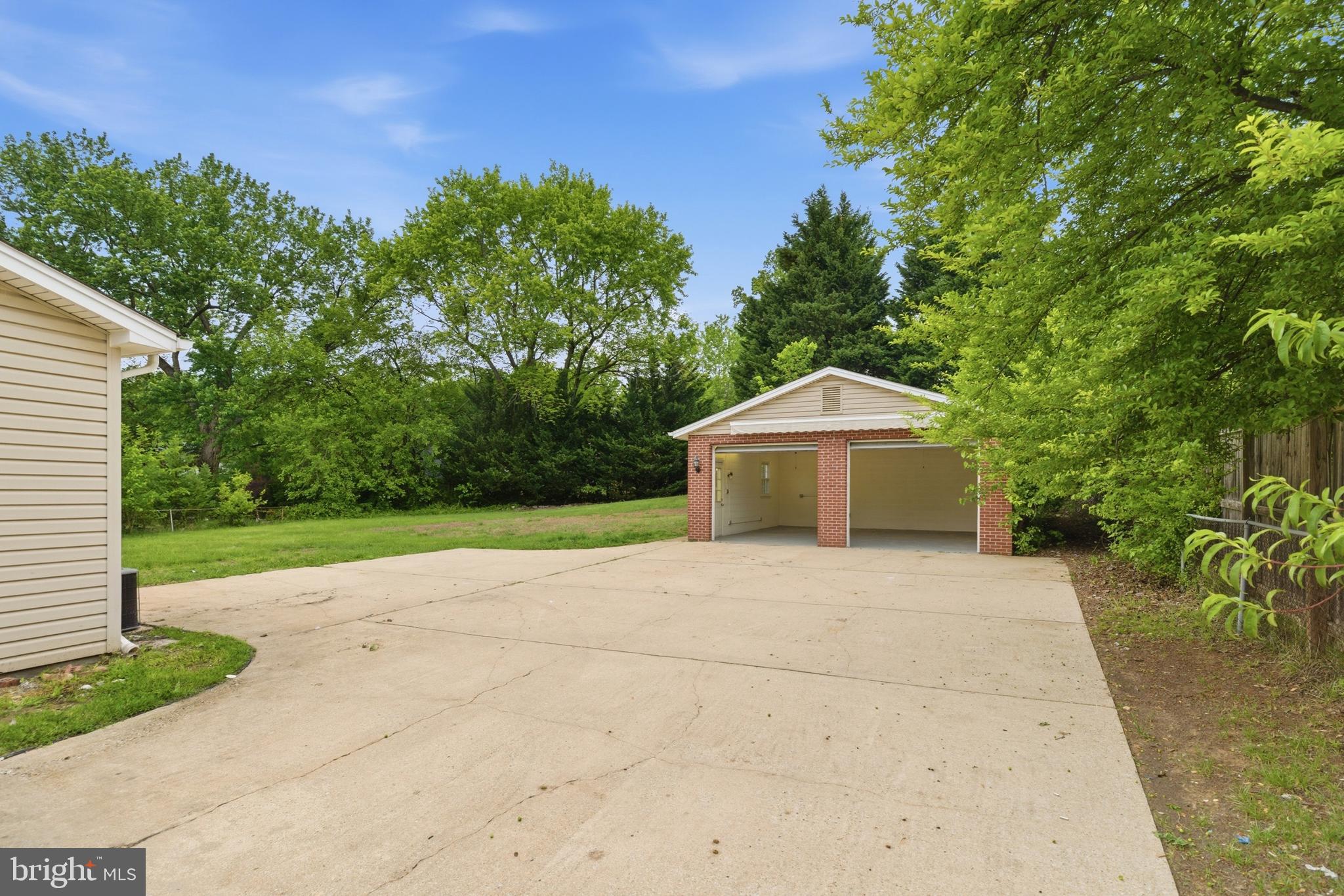 14033 Grayson Road Woodbridge, VA 22191 - Photo 31 of 33 a white house with a yard