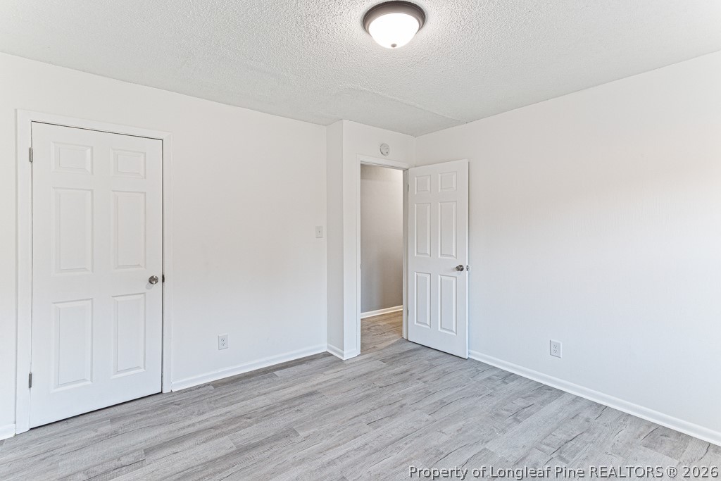 922 Rancho Drive Fayetteville, NC 28303 - Photo 20 of 21 an empty room with wooden floor
