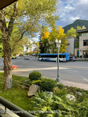 a view of street with cars parked