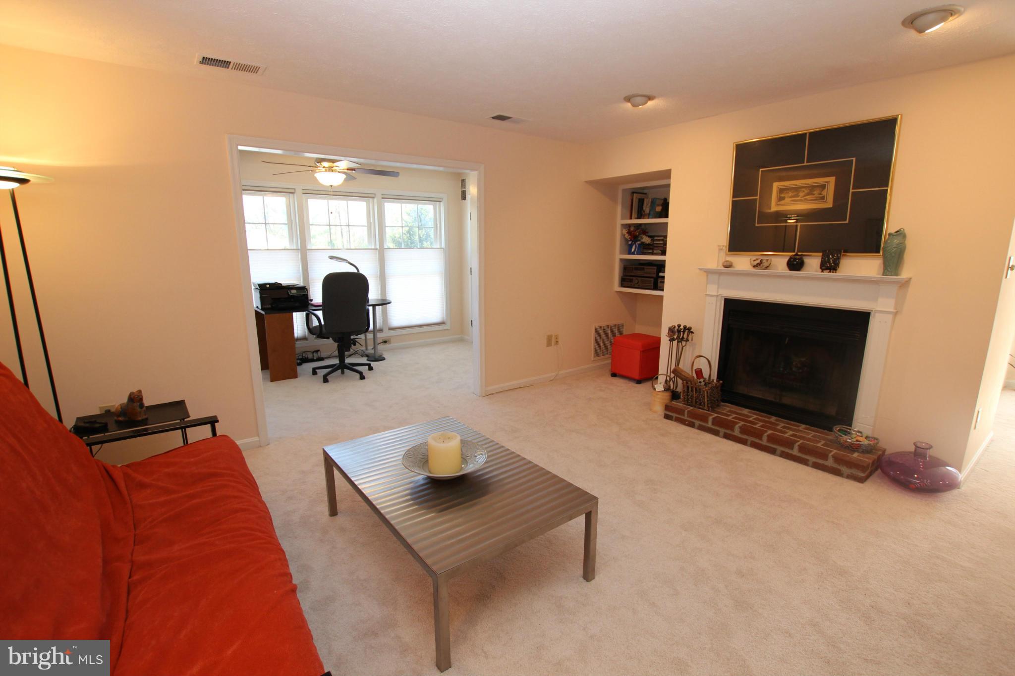10174 Oakton Terrace Road, Unit 10174 Oakton, VA 22124 - Photo 11 of 30 Living Room with Woodburning Fireplace