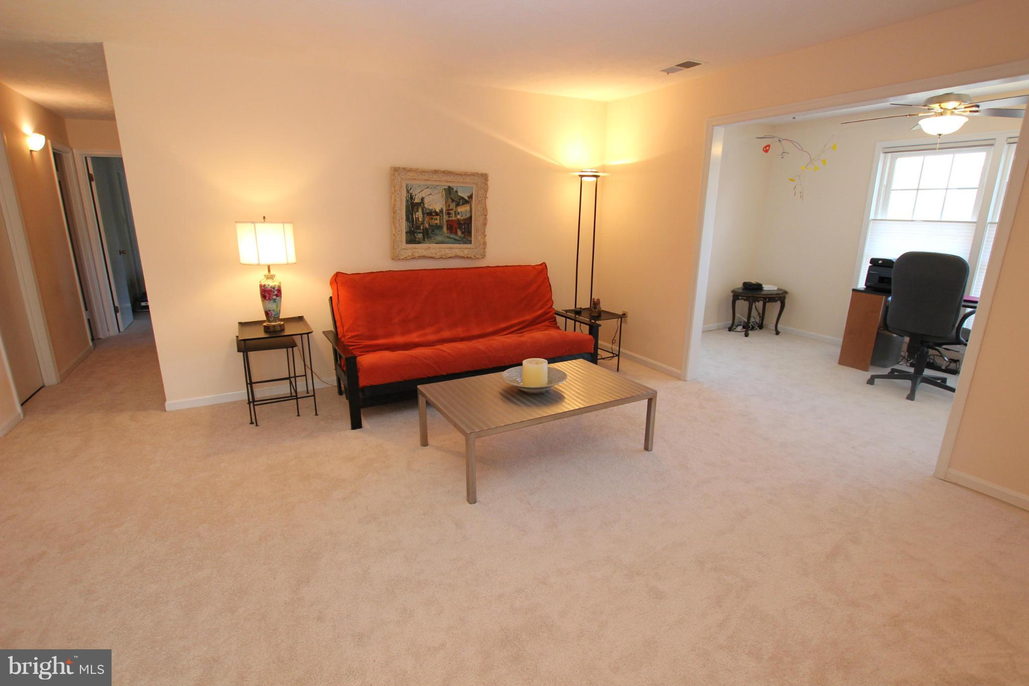 10174 Oakton Terrace Road, Unit 10174 Oakton, VA 22124 - Photo 12 of 30 Living Room Open to Sunroom