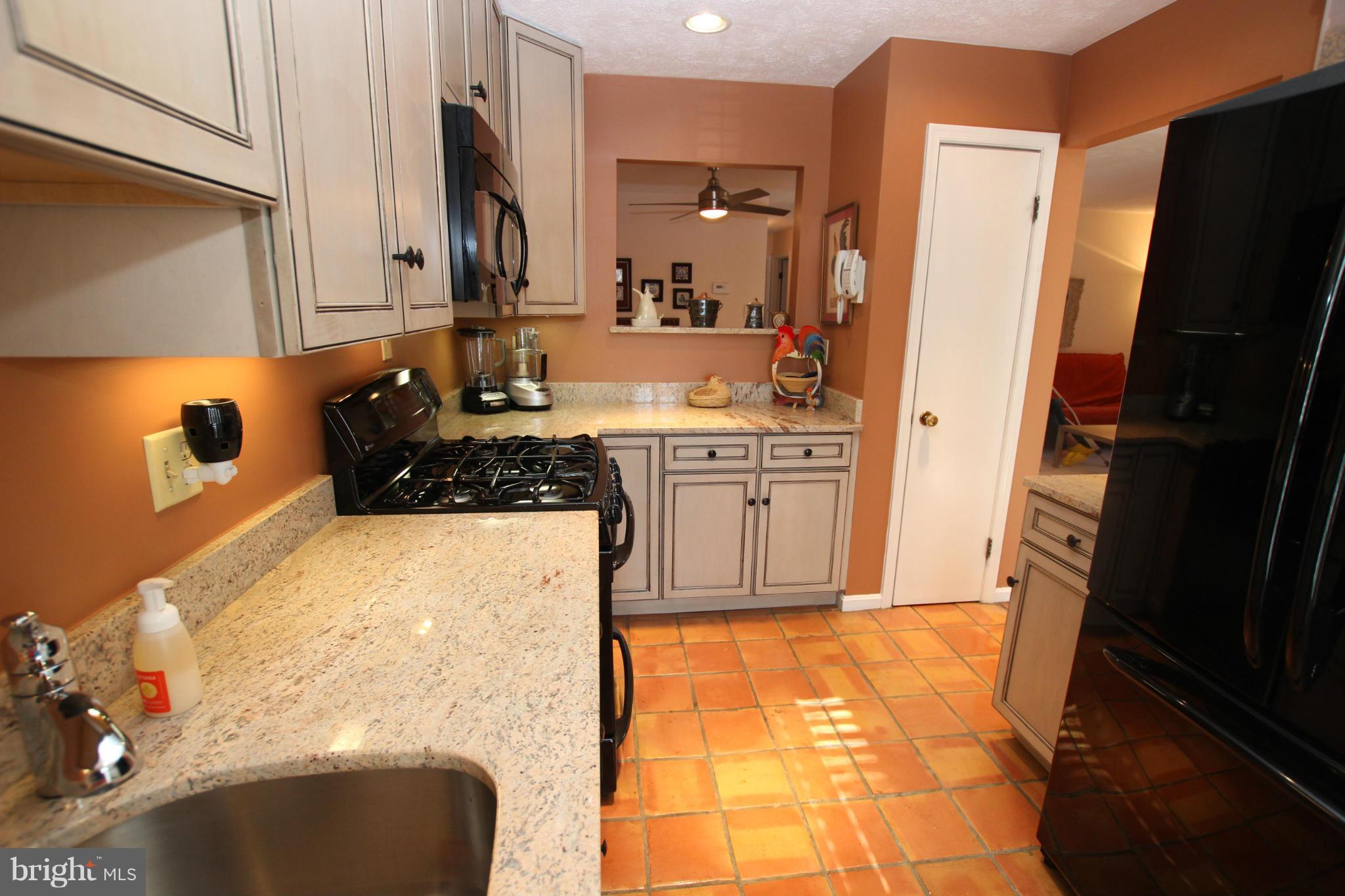 10174 Oakton Terrace Road, Unit 10174 Oakton, VA 22124 - Photo 8 of 30 Kitchen pass thru to Dining Rm