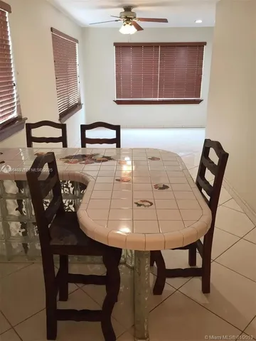 a view of a workspace with furniture