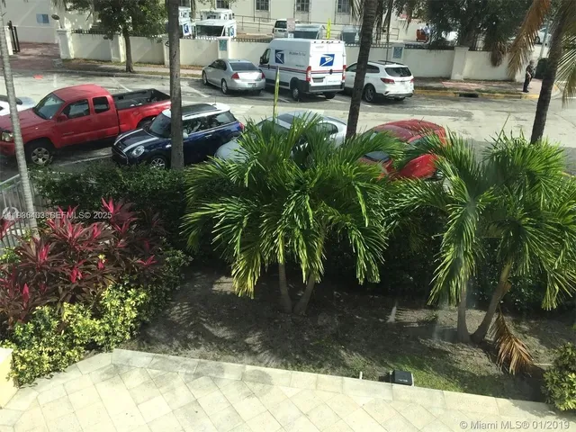 a view of yard with car parked