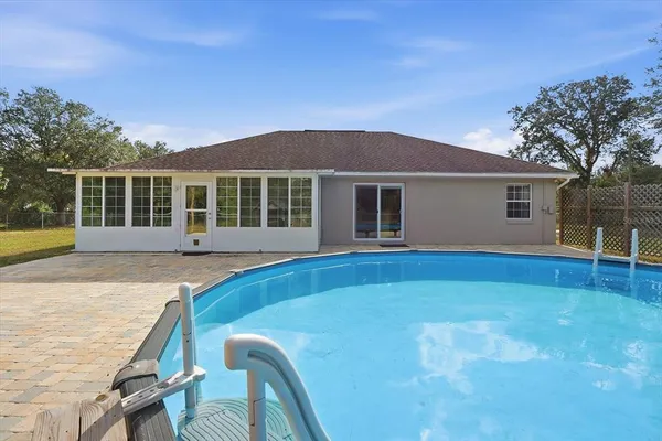 a house with trees in the background