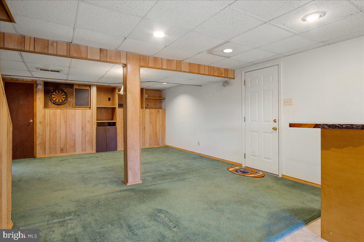 147 Den Road Lincoln University, PA 19352 - Photo 27 of 36 Finished basement - door to garage