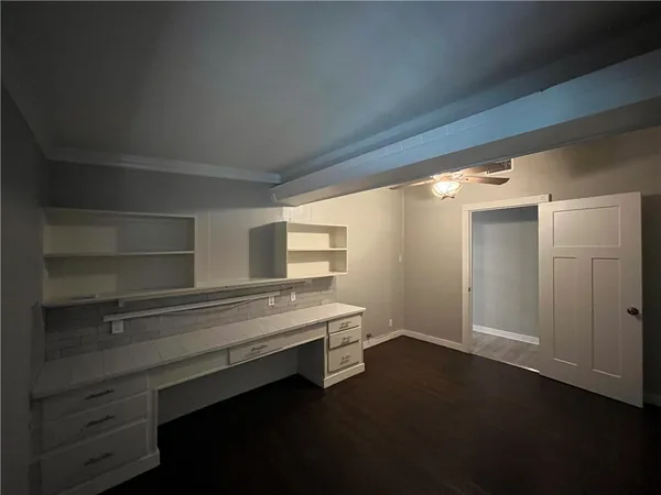 a view of room with window and cabinet