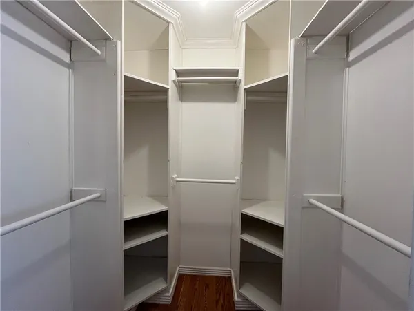 a view of an empty walk in closet