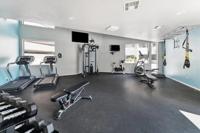 a view of swimming pool with outdoor seating and city view