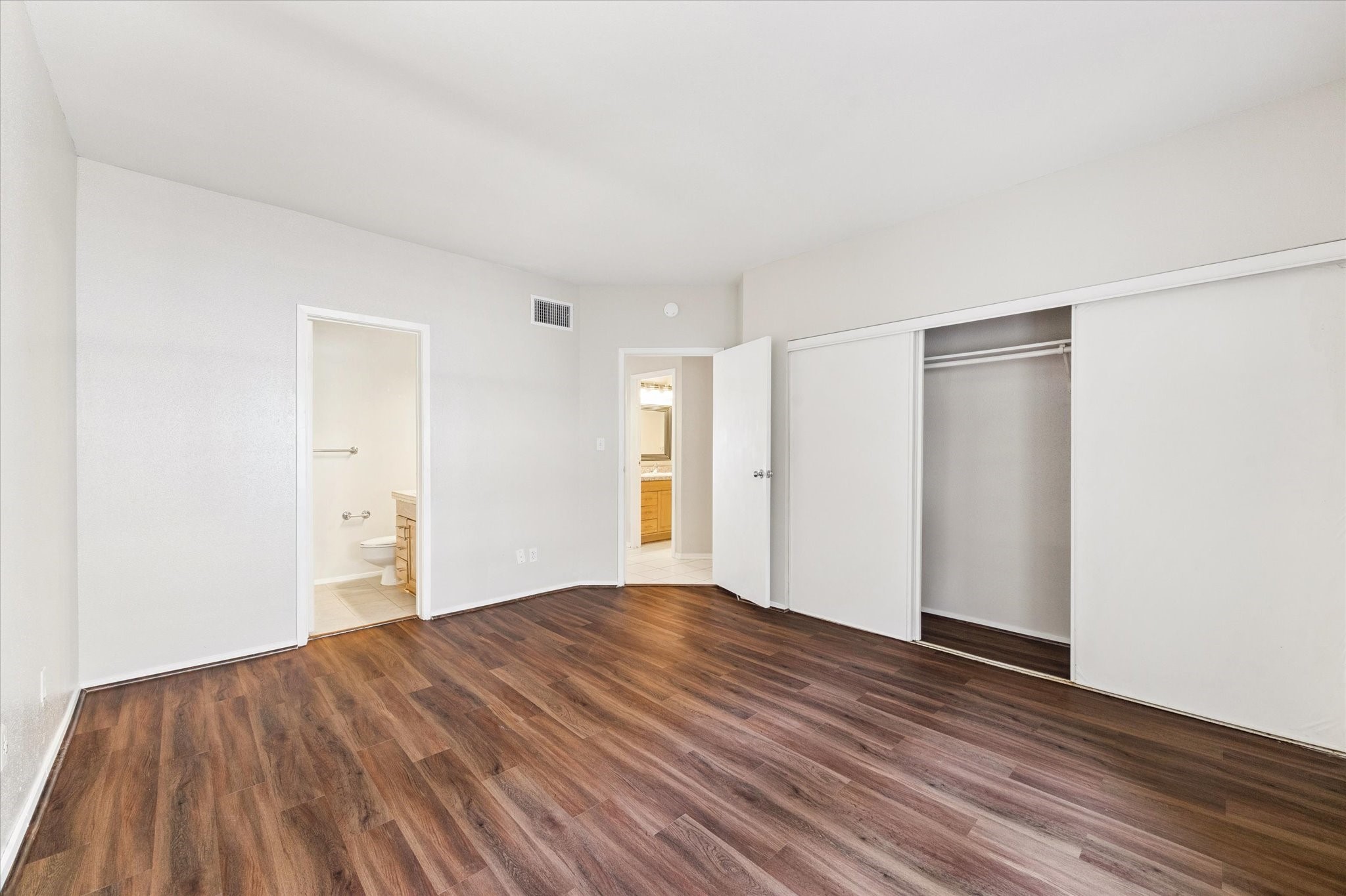 1819 Augusta Drive, Unit C28 Houston, TX 77057 - Photo 6 of 17 a view of empty room with wooden floor