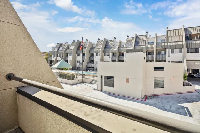 a front view of a building with garden and entertaining space