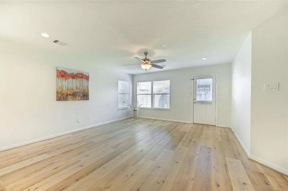 15331 Keystone Bend Lane Cypress, TX 77429 - Photo 12 of 18 wooden floor in an empty room with a window