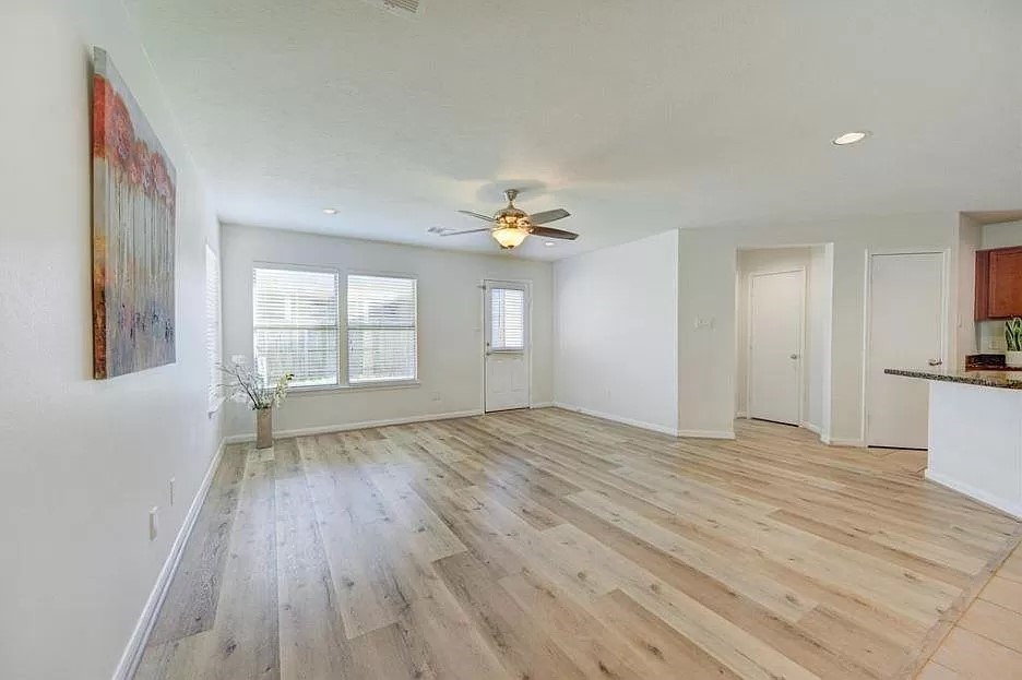 15331 Keystone Bend Lane Cypress, TX 77429 - Photo 13 of 18 a view of empty room with wooden floor and fan