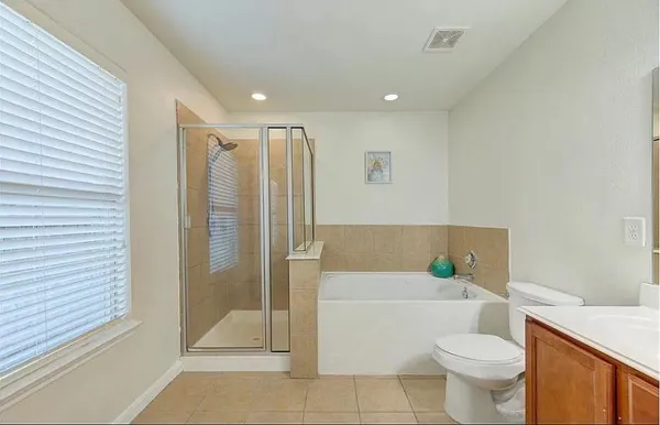 a bathroom with a toilet a sink and bathtub