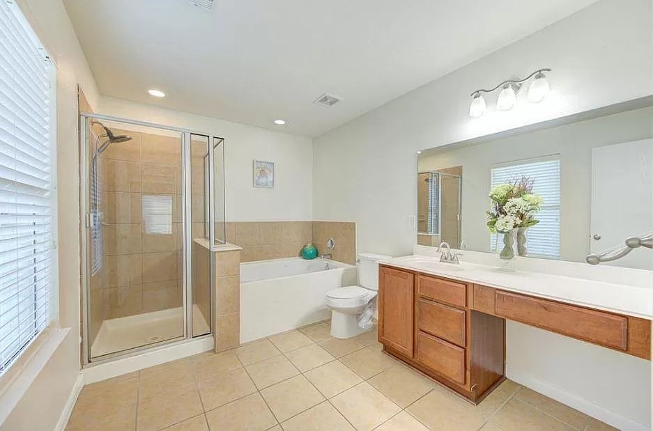 15331 Keystone Bend Lane Cypress, TX 77429 - Photo 16 of 18 a bathroom with a sink a toilet and shower