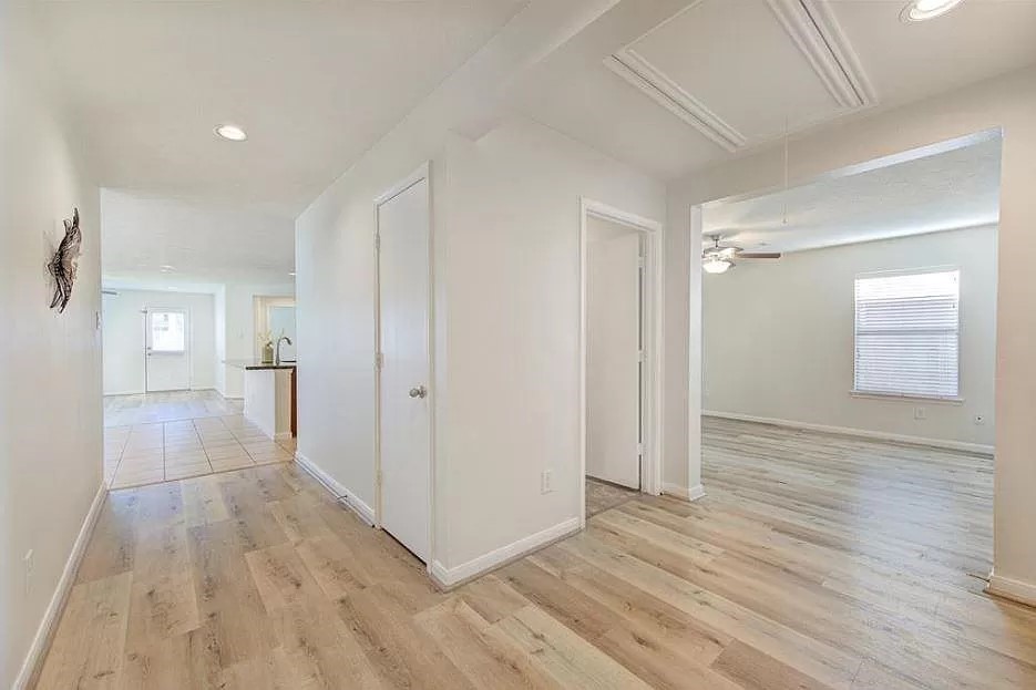 15331 Keystone Bend Lane Cypress, TX 77429 - Photo 8 of 18 a view of a room with wooden floor and a bathroom