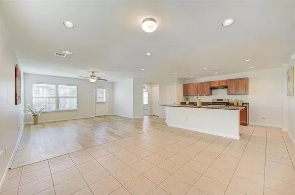 a view of kitchen appliances with cabinets in front of it