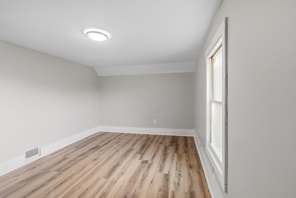 834 Worthington Street, Unit 2 Springfield, MA 01105 - Photo 14 of 20 a view of wooden floor in a room