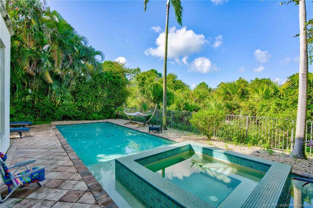 108 Tulip Tree Court Jupiter, FL 33458 - Photo 11 of 41 a view of a backyard with sitting area
