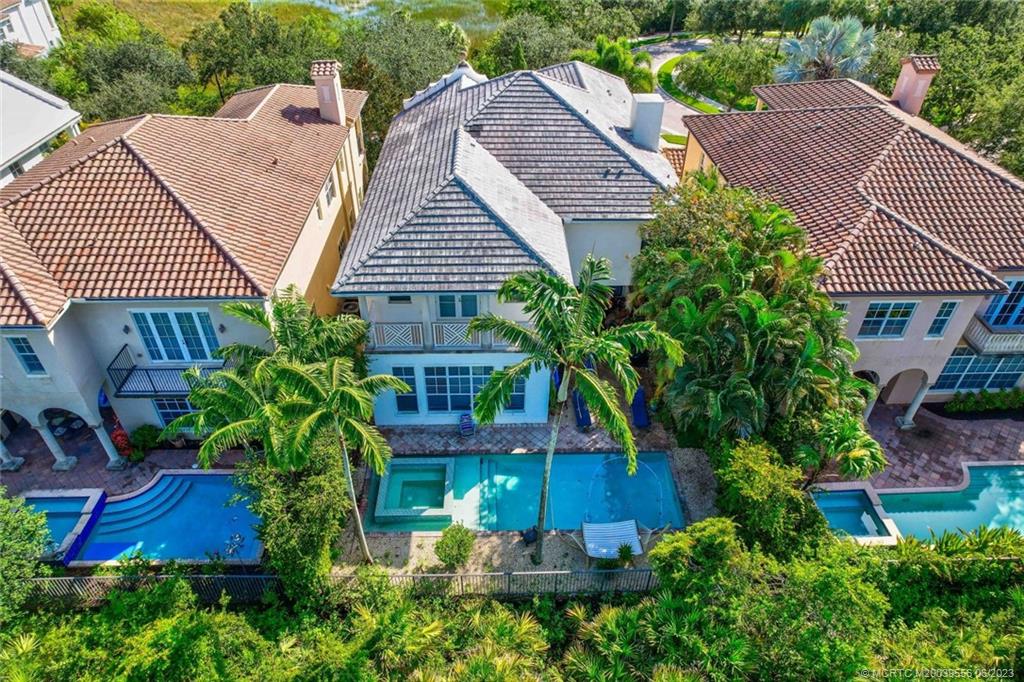108 Tulip Tree Court Jupiter, FL 33458 - Photo 16 of 41 a aerial view of a house with a yard and potted plants