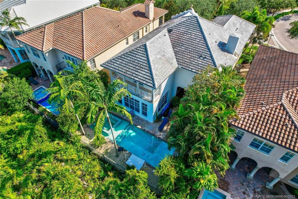 108 Tulip Tree Court Jupiter, FL 33458 - Photo 17 of 41 an aerial view of a house with a yard and potted plants