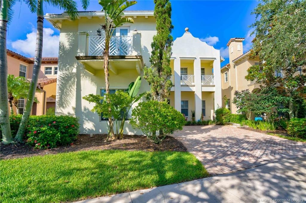 108 Tulip Tree Court Jupiter, FL 33458 - Photo 2 of 41 a front view of a house with a yard