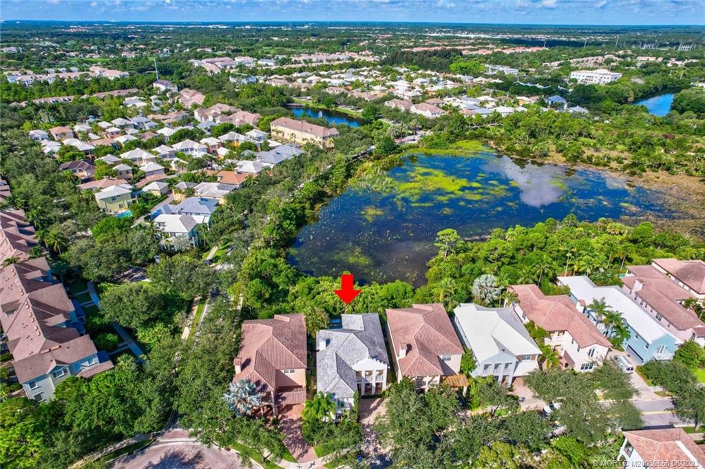 108 Tulip Tree Court Jupiter, FL 33458 - Photo 21 of 41 an aerial view of residential houses with outdoor space and trees