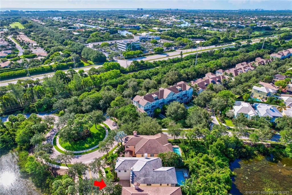 108 Tulip Tree Court Jupiter, FL 33458 - Photo 22 of 41 an aerial view of residential houses with outdoor space and trees