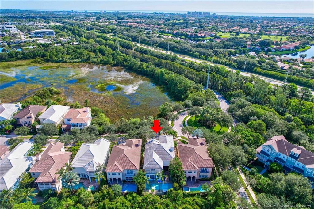 108 Tulip Tree Court Jupiter, FL 33458 - Photo 23 of 41 an aerial view of residential houses with outdoor space and river