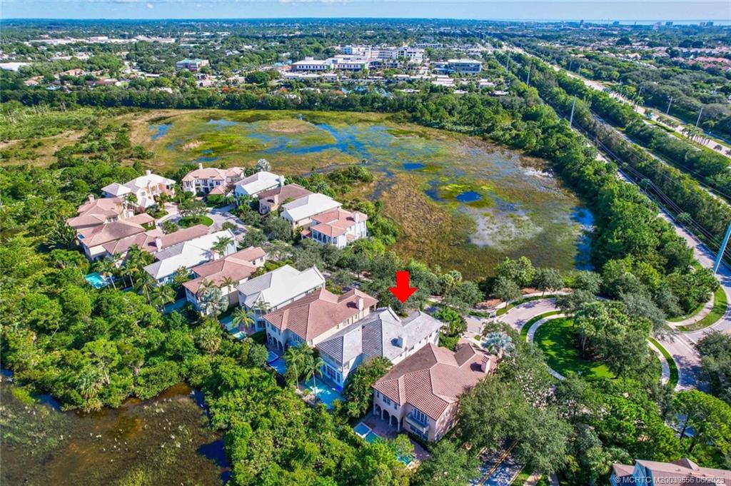 108 Tulip Tree Court Jupiter, FL 33458 - Photo 24 of 41 an aerial view of residential houses with outdoor space and trees